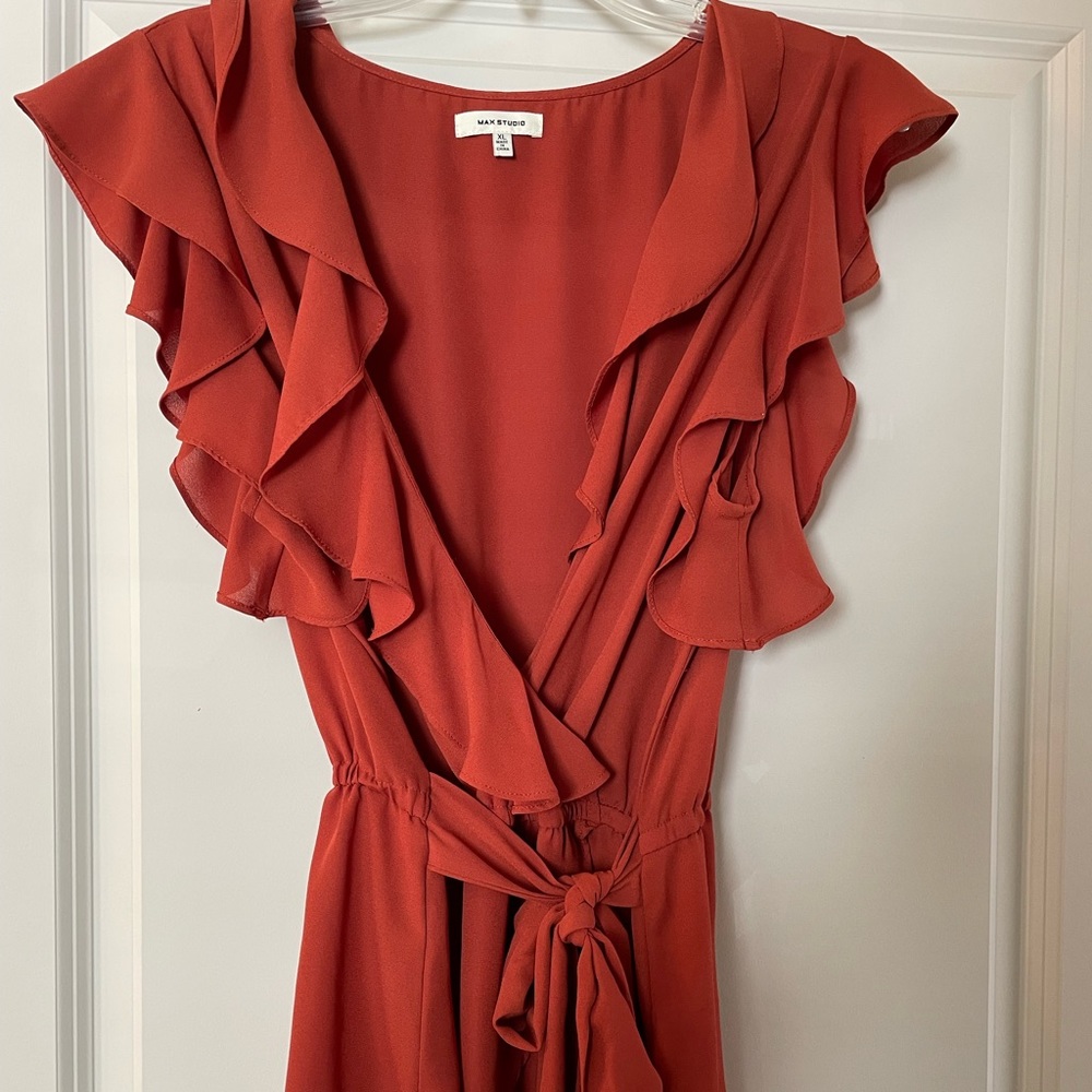 Ruffle top in burnt orange color. Size XL